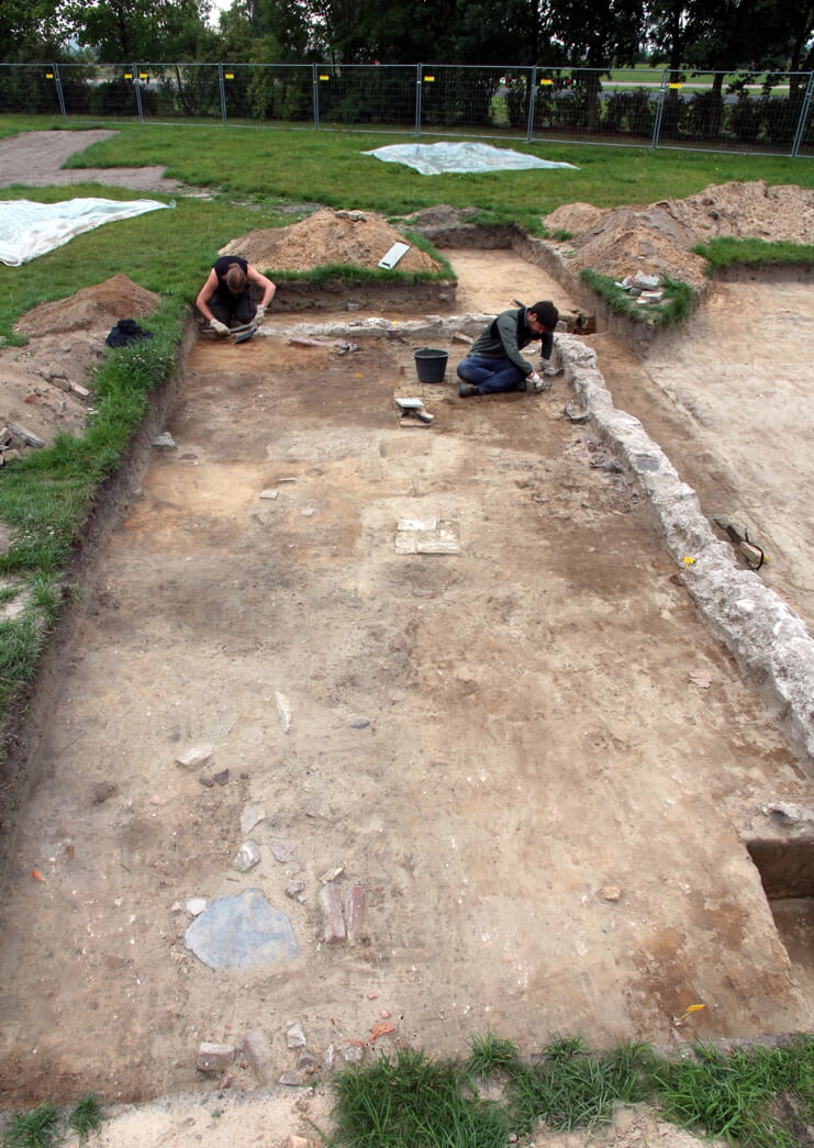 Photograph of archaeologists excavating barrack foundations at Tempelhof.