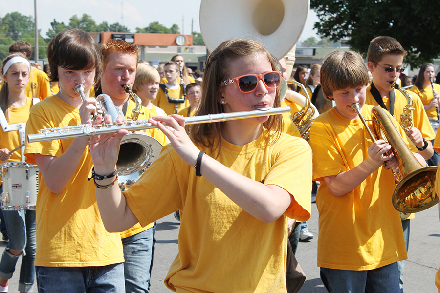 Adolescents play instruments in a band