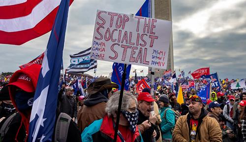 Trump supporters carrying “Stop the Steal” signs gather in front of the US Capitol.