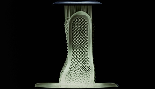 Intricately latticed polymer midsole for running shoe emerging from unstructured resin via 3-D printing.