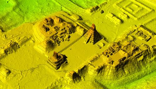 A topographic map with lines and shades of green, yellow and brown to indicate elevation. Large structures and smaller walls and bumps are visible.