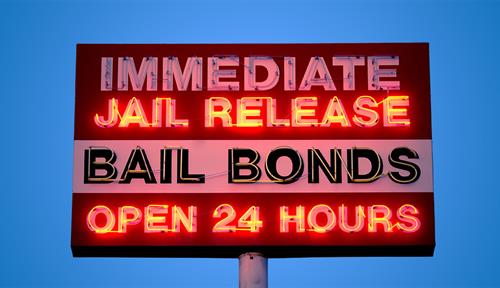 Photo of a neon sign advertising a bail-bond service