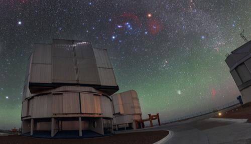 Starry night sky over a closed telescope unit at the Very Large Telescope in Chile