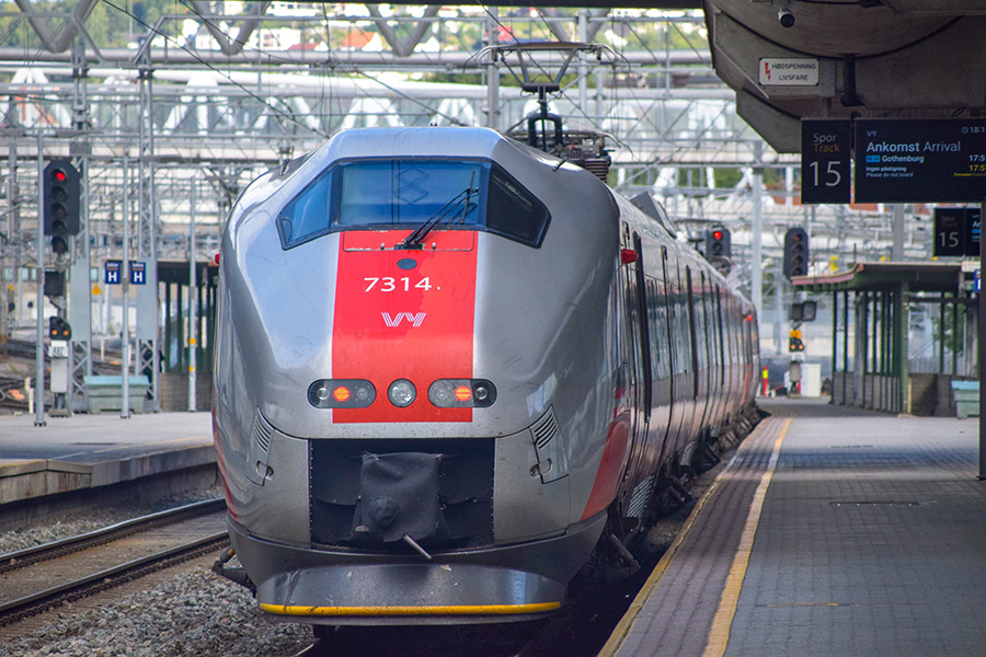 Photograph of a train standing in a station.